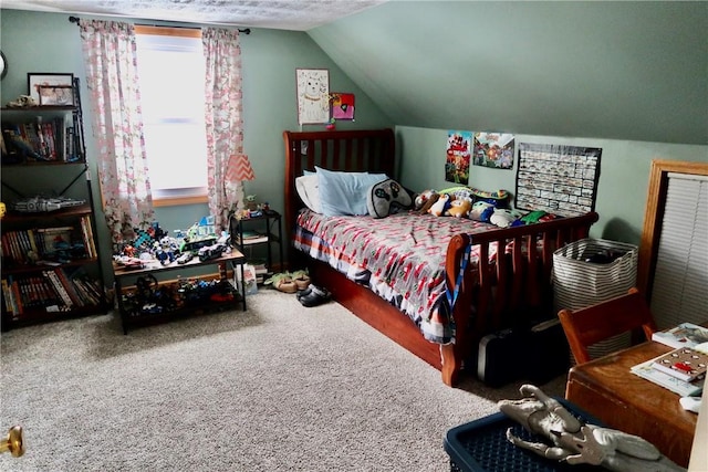 bedroom featuring carpet and vaulted ceiling