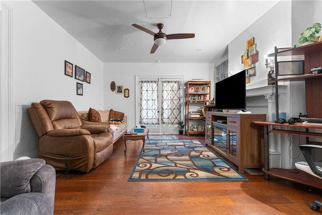 living room featuring hardwood / wood-style floors and ceiling fan