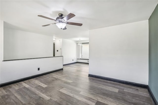 empty room featuring ceiling fan and wood-type flooring