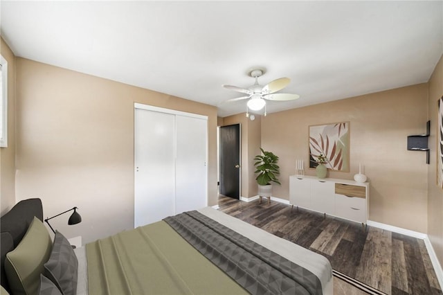 bedroom with ceiling fan, a closet, and wood-type flooring