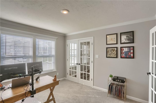 home office featuring a textured ceiling, light colored carpet, crown molding, and french doors