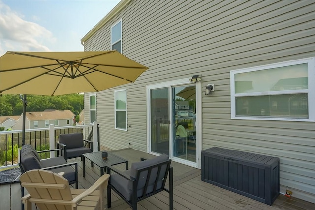 deck featuring radiator and an outdoor living space