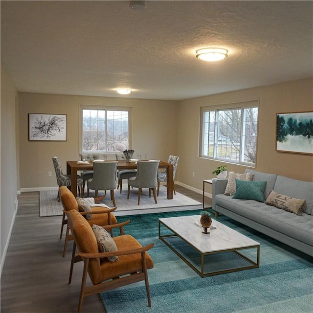 living room with dark hardwood / wood-style flooring and a textured ceiling