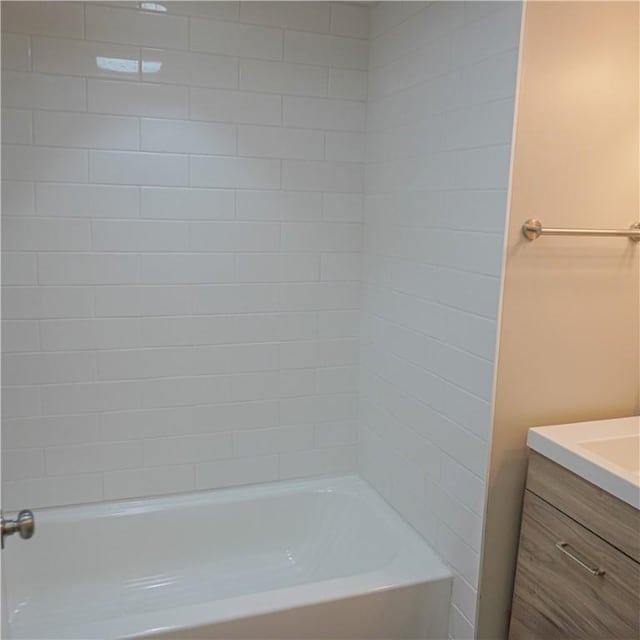 bathroom featuring vanity and bathing tub / shower combination