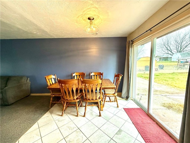 dining area with tile patterned flooring