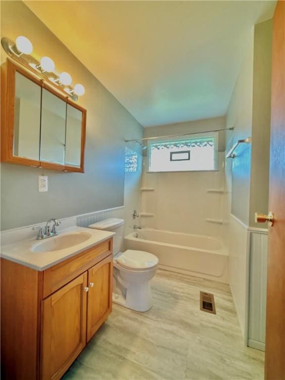 full bathroom with vanity,  shower combination, and toilet