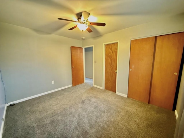 unfurnished bedroom with carpet flooring and ceiling fan