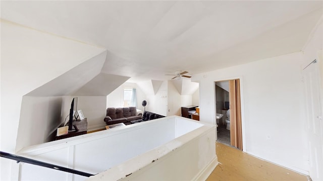 interior space with light hardwood / wood-style flooring and vaulted ceiling