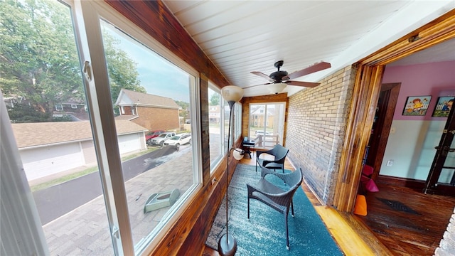 sunroom / solarium with ceiling fan