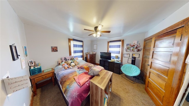 carpeted bedroom with ceiling fan