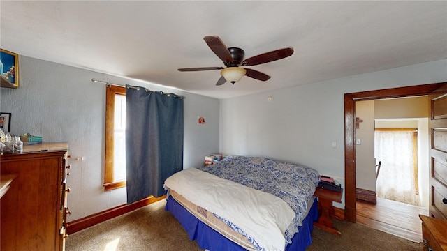 carpeted bedroom with ceiling fan