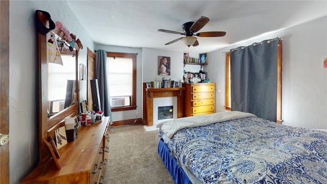 carpeted bedroom featuring ceiling fan