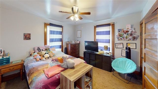 carpeted bedroom with ceiling fan