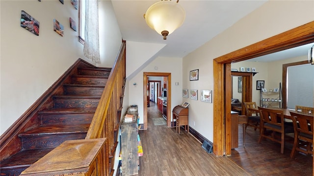 staircase featuring wood-type flooring