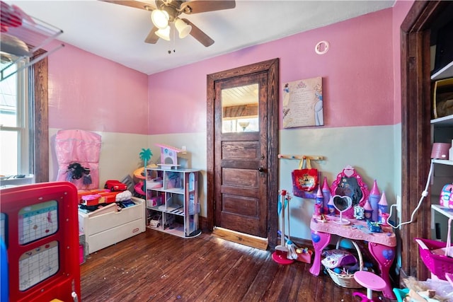 rec room featuring a healthy amount of sunlight, ceiling fan, and hardwood / wood-style flooring
