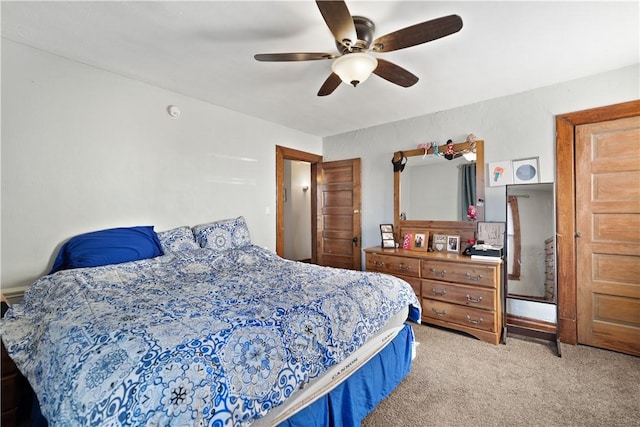 bedroom with light carpet and a ceiling fan
