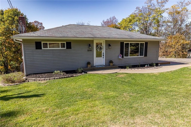 ranch-style home with a front lawn