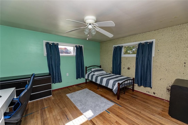 bedroom featuring ceiling fan and wood-type flooring