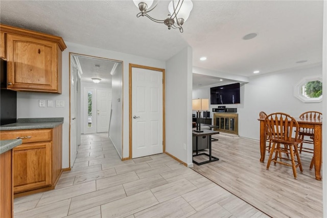 kitchen with decorative light fixtures and an inviting chandelier