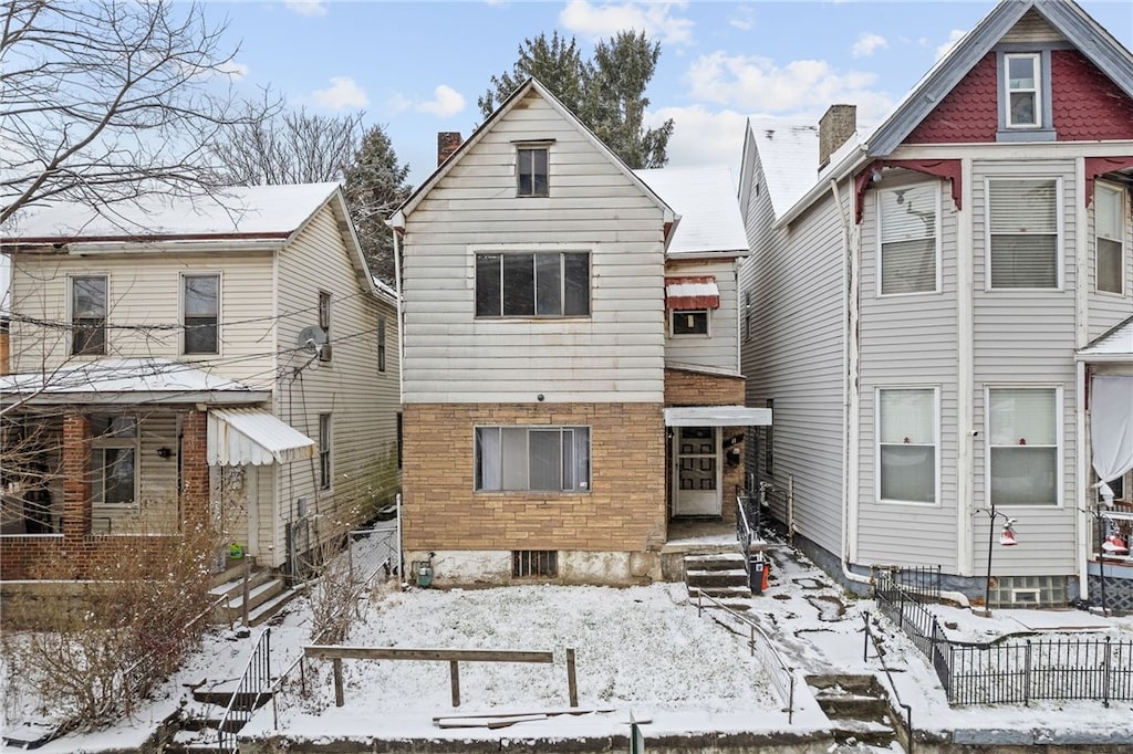 view of snow covered house