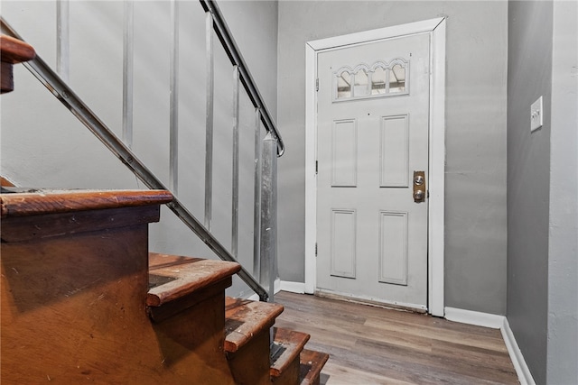 foyer entrance with light hardwood / wood-style flooring