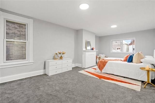 bedroom featuring dark colored carpet