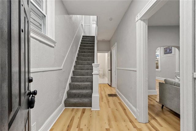 staircase featuring hardwood / wood-style floors