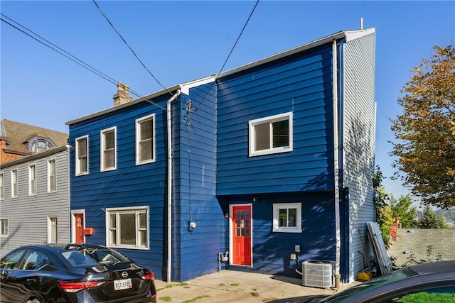 view of front of house featuring cooling unit