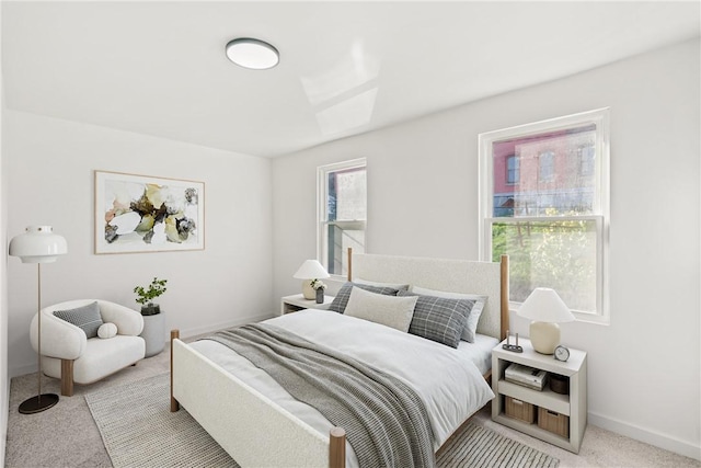 bedroom featuring light colored carpet