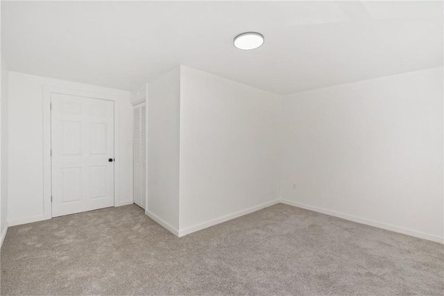 bonus room with light carpet