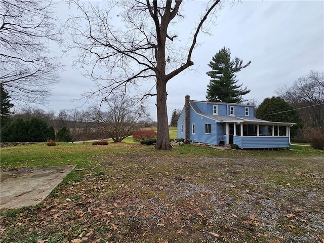 view of yard featuring a sunroom