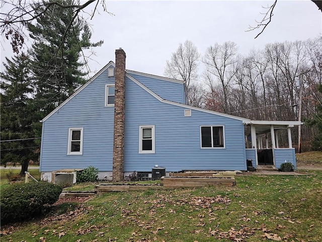 rear view of house with a lawn