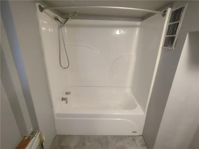 bathroom with shower / tub combination