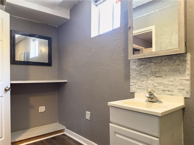 bathroom with vanity and hardwood / wood-style flooring