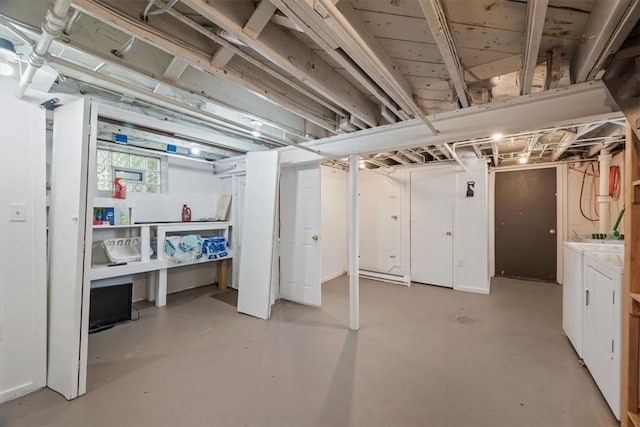 basement with washer and clothes dryer