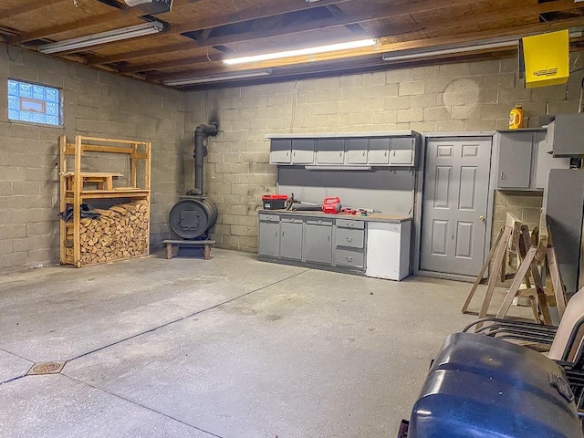 basement featuring a wood stove