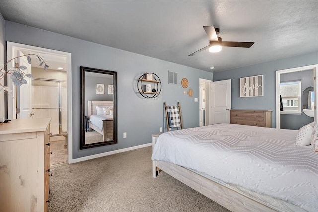 bedroom featuring carpet floors, ensuite bathroom, and ceiling fan