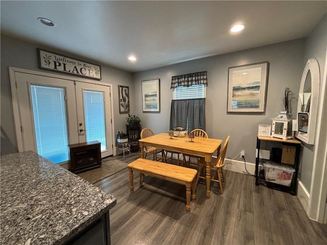 dining room featuring dark hardwood / wood-style floors and french doors