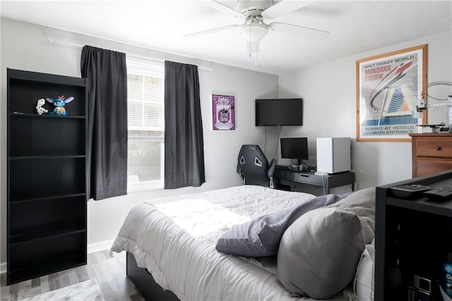 bedroom featuring ceiling fan and light hardwood / wood-style flooring