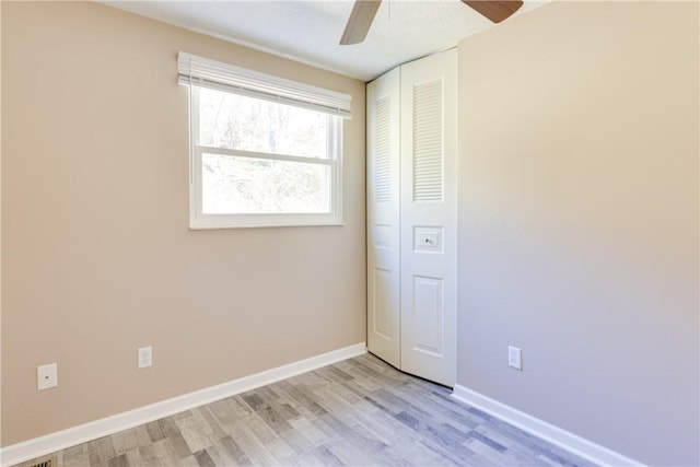 unfurnished bedroom with a closet, ceiling fan, and light hardwood / wood-style floors