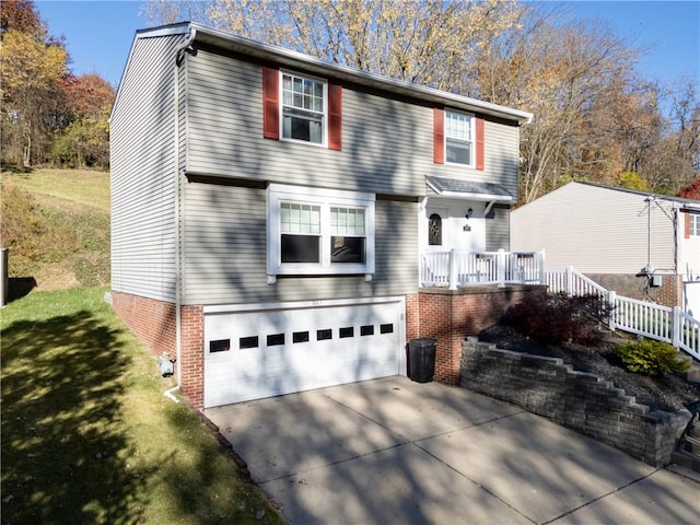 view of front of home with a garage and a front lawn