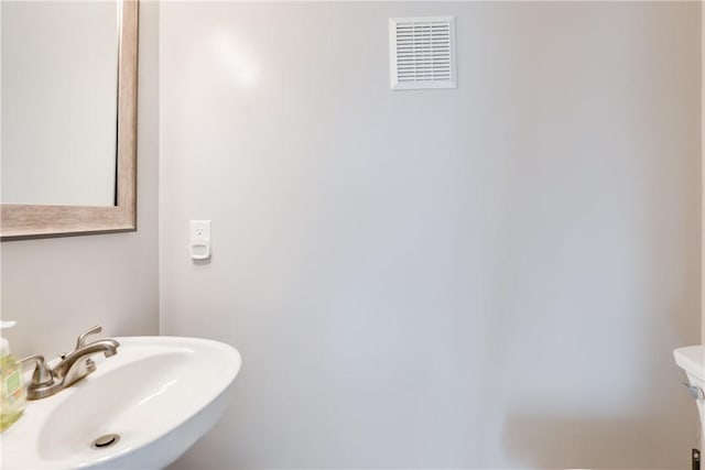 bathroom with sink and toilet