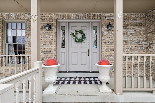 property entrance featuring covered porch