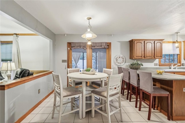 tiled dining room with sink