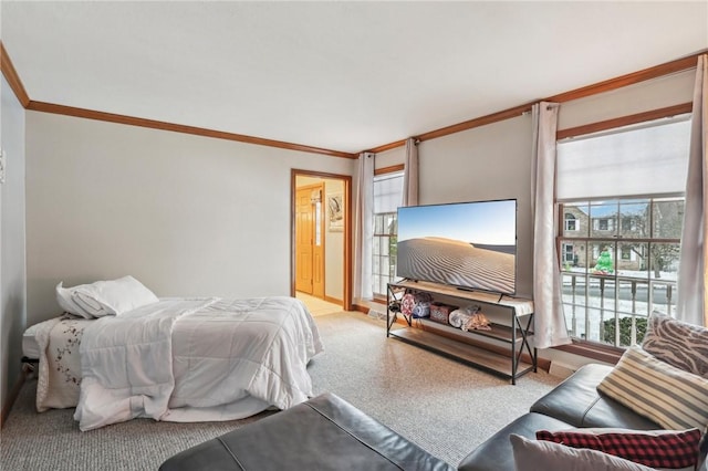 bedroom featuring connected bathroom and crown molding