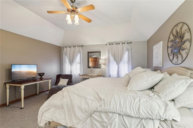 bedroom featuring multiple windows, ceiling fan, carpet floors, and vaulted ceiling