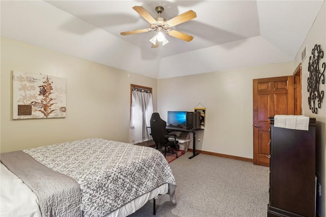 bedroom with a tray ceiling, ceiling fan, and light colored carpet