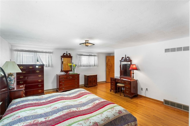 bedroom featuring light hardwood / wood-style floors