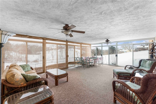 sunroom / solarium with ceiling fan