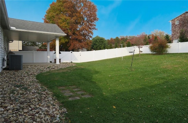 view of yard with central AC unit